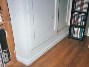 hard plastic cover for wires runs along the baseboards