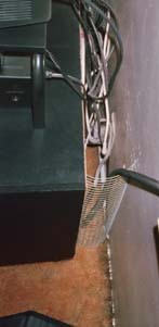 A chicken wire rabbit baffle behind the TV